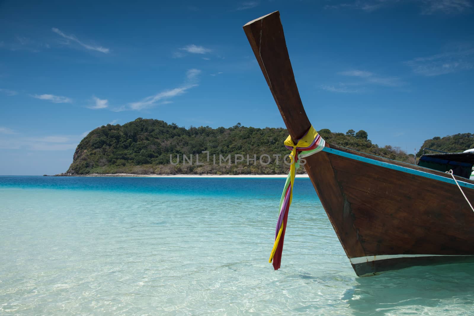 Long tailed boat on the sand beach at KohRook island south of Thailand