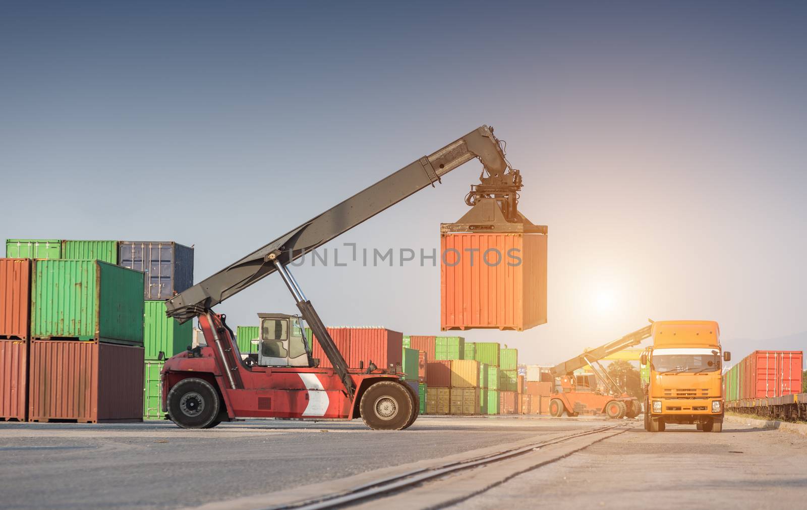 Forklift handling container box loading at the Docks with Truck