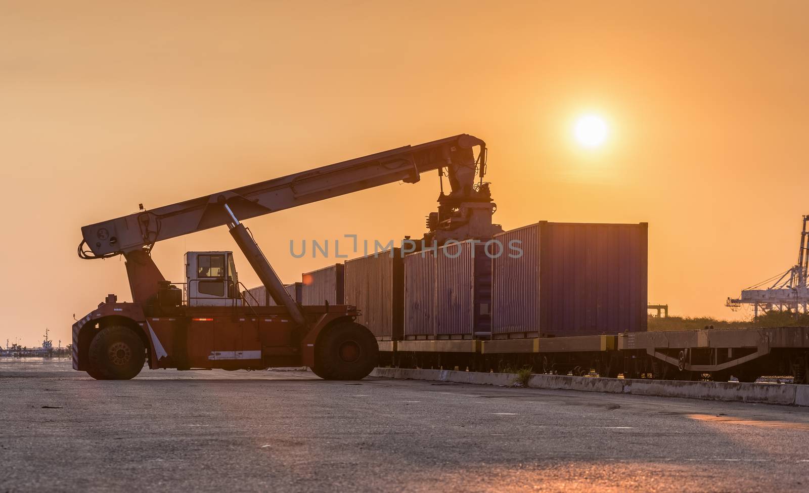 Forklift handling container box loading at the Docks to Truck