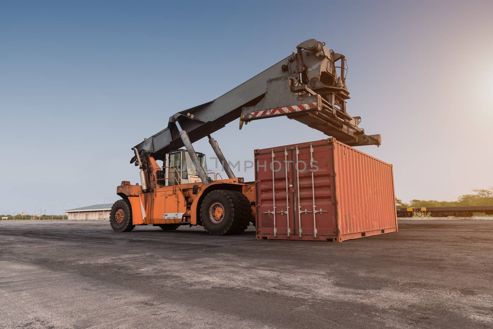 Forklift handling container box loading at the Docks with Truck