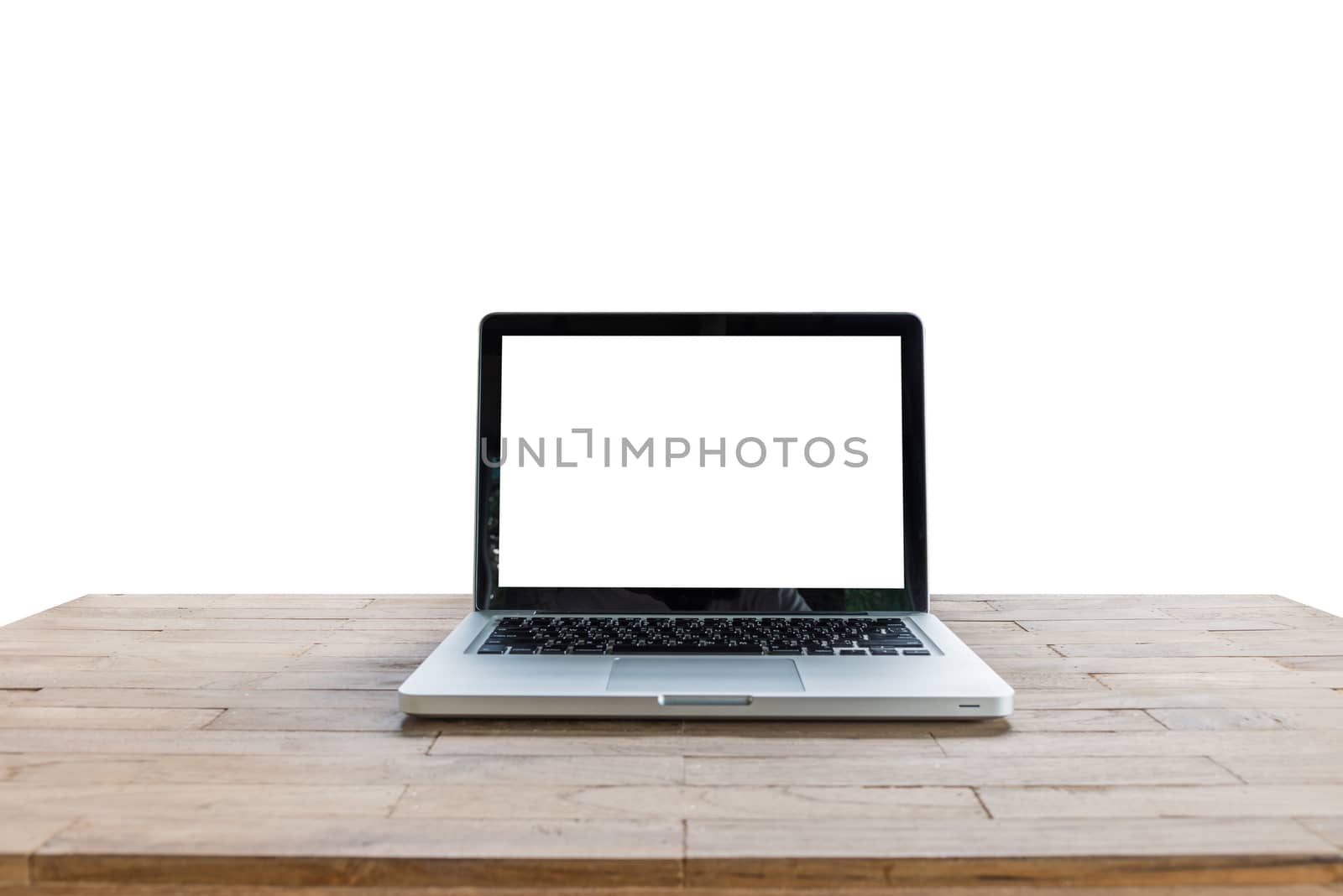 Laptop on desk table isolated on white background