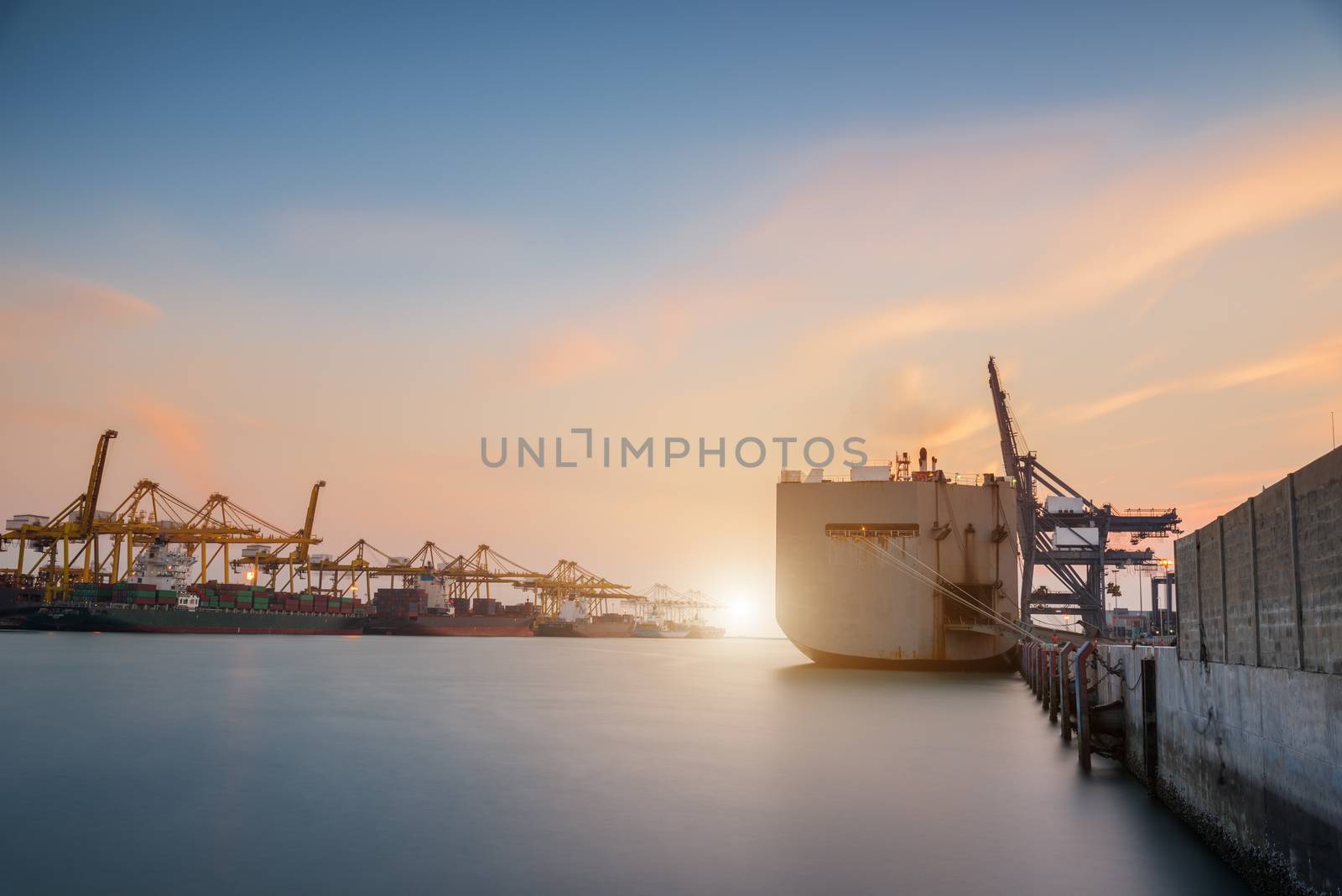 Cargo or Trade Shipping Port at sunrise