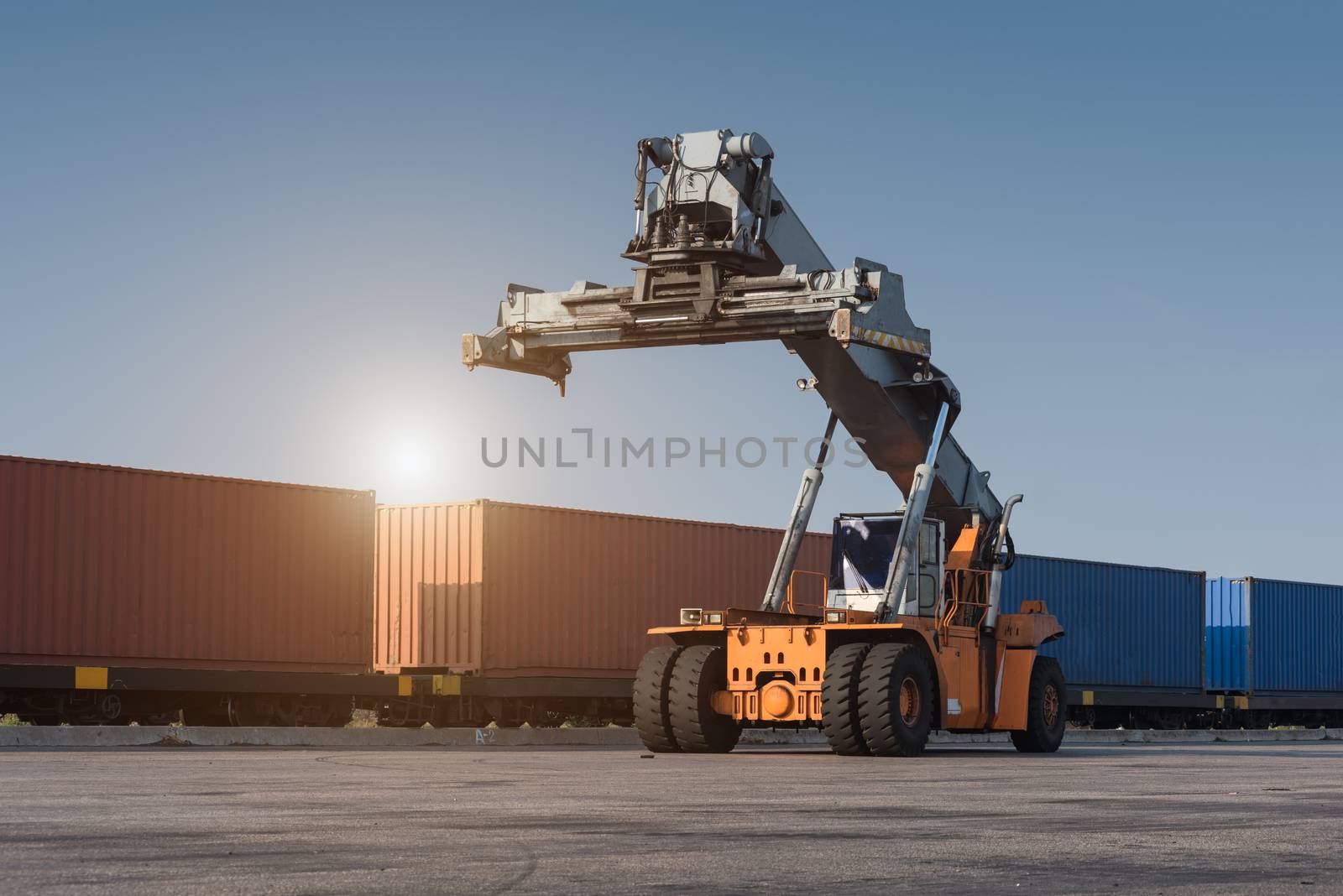 forklift handling container box loading from dock to truck