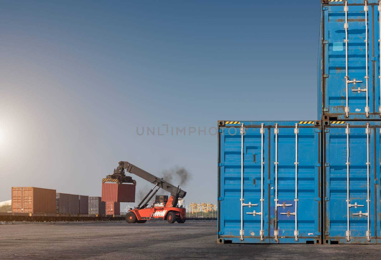 forklift handling container box loading from dock to truck