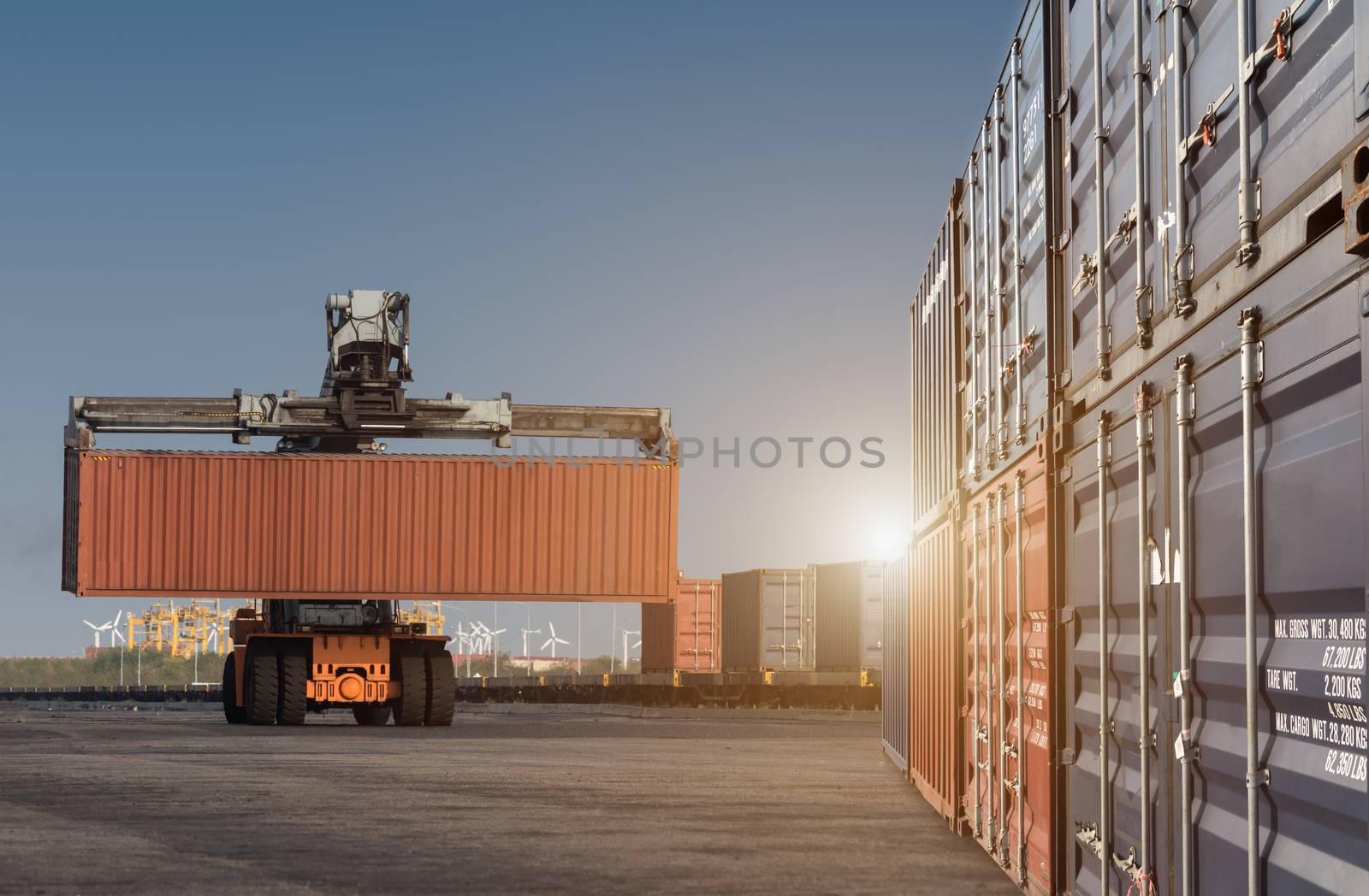 forklift handling container box loading from dock to truck