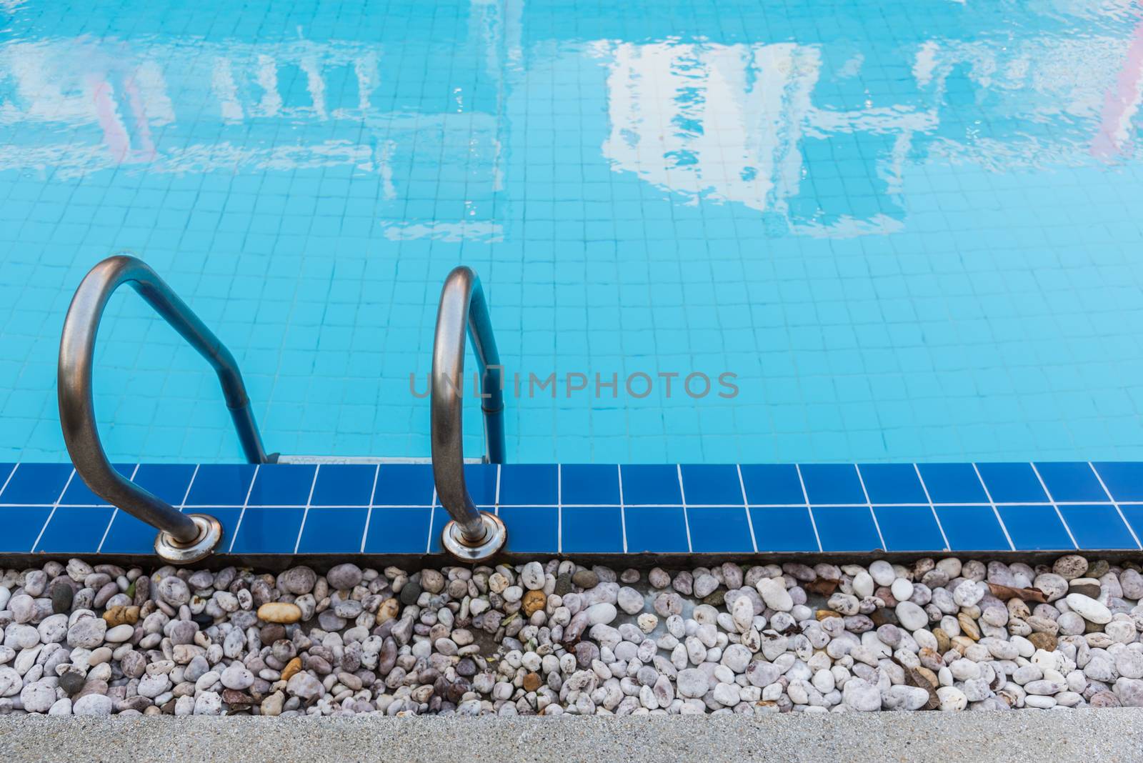 Hotel blue swimming pool by Sorapop