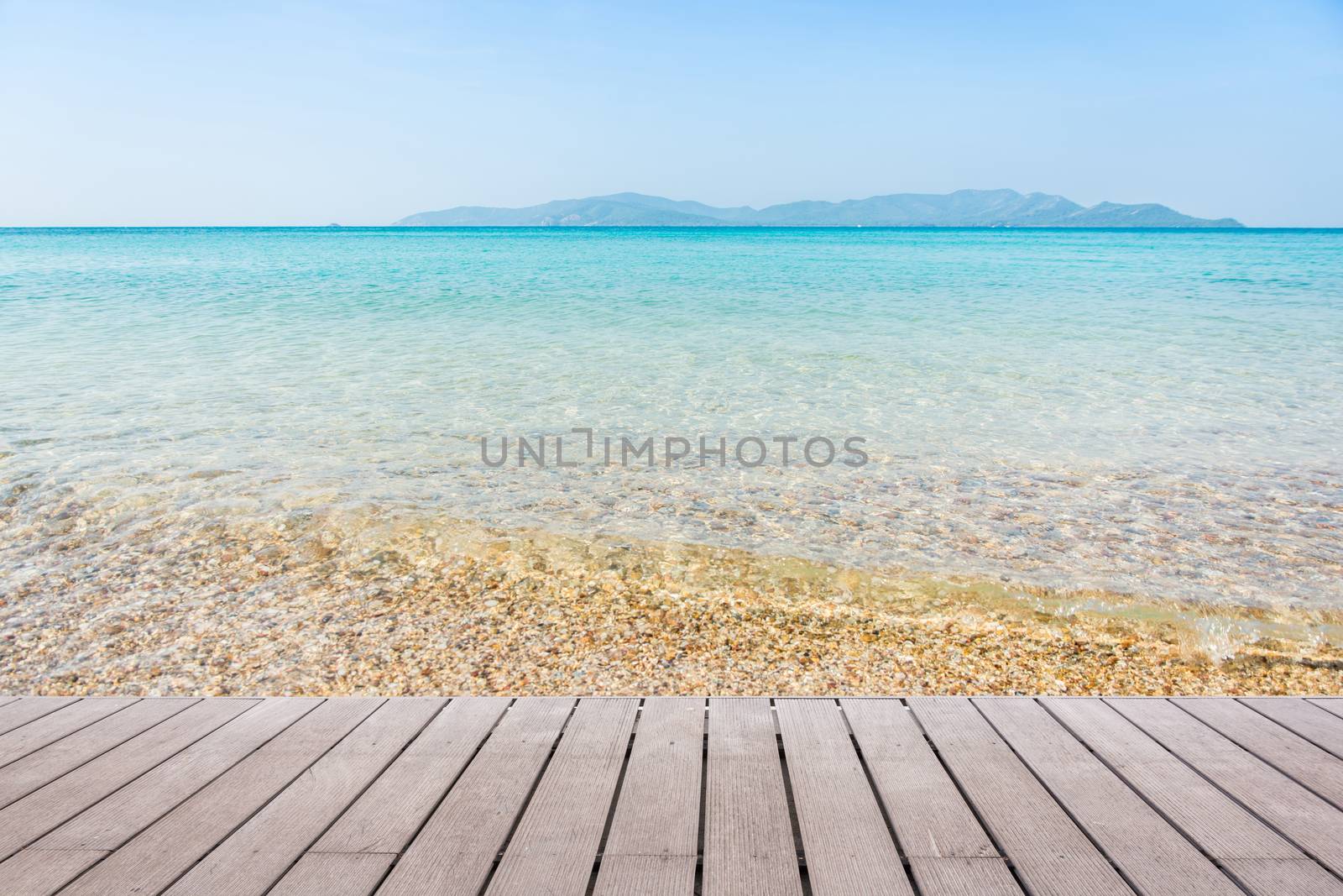 Beach Scene With Wooden Floor background can put or montage your products