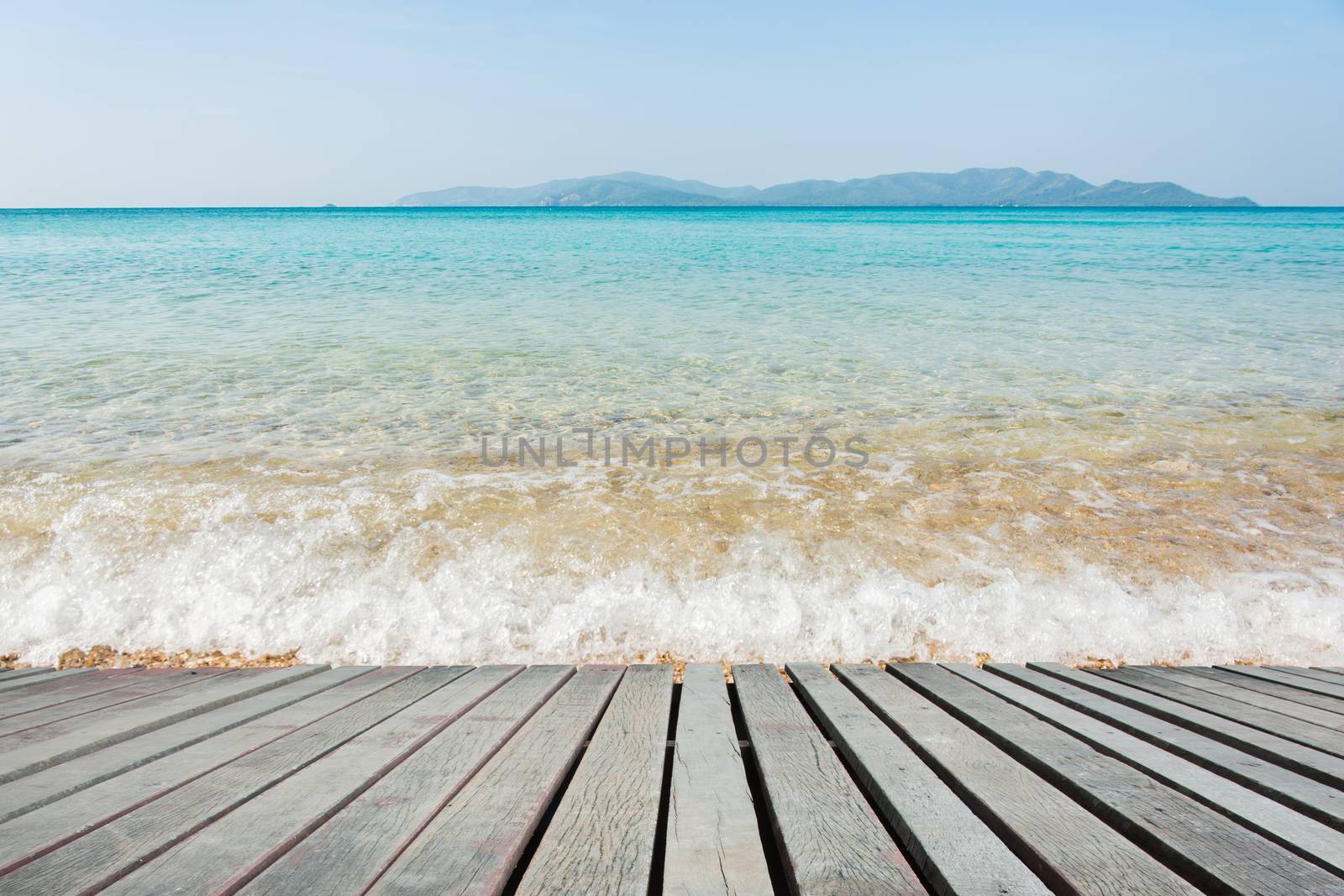 Beach Scene With Wooden Floor background can put or montage your products