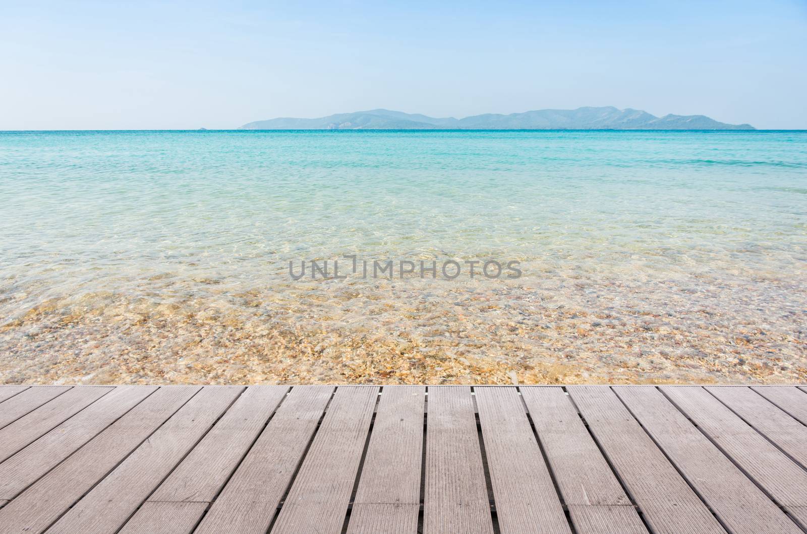 Beach Scene With Wooden Floor background can put or montage your products