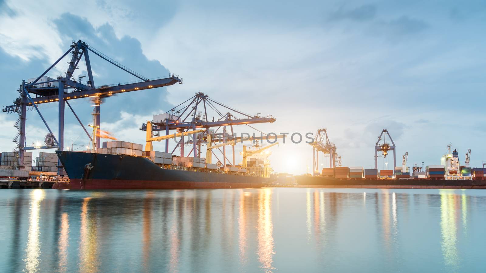 Container ship in the harbor at sunrise
