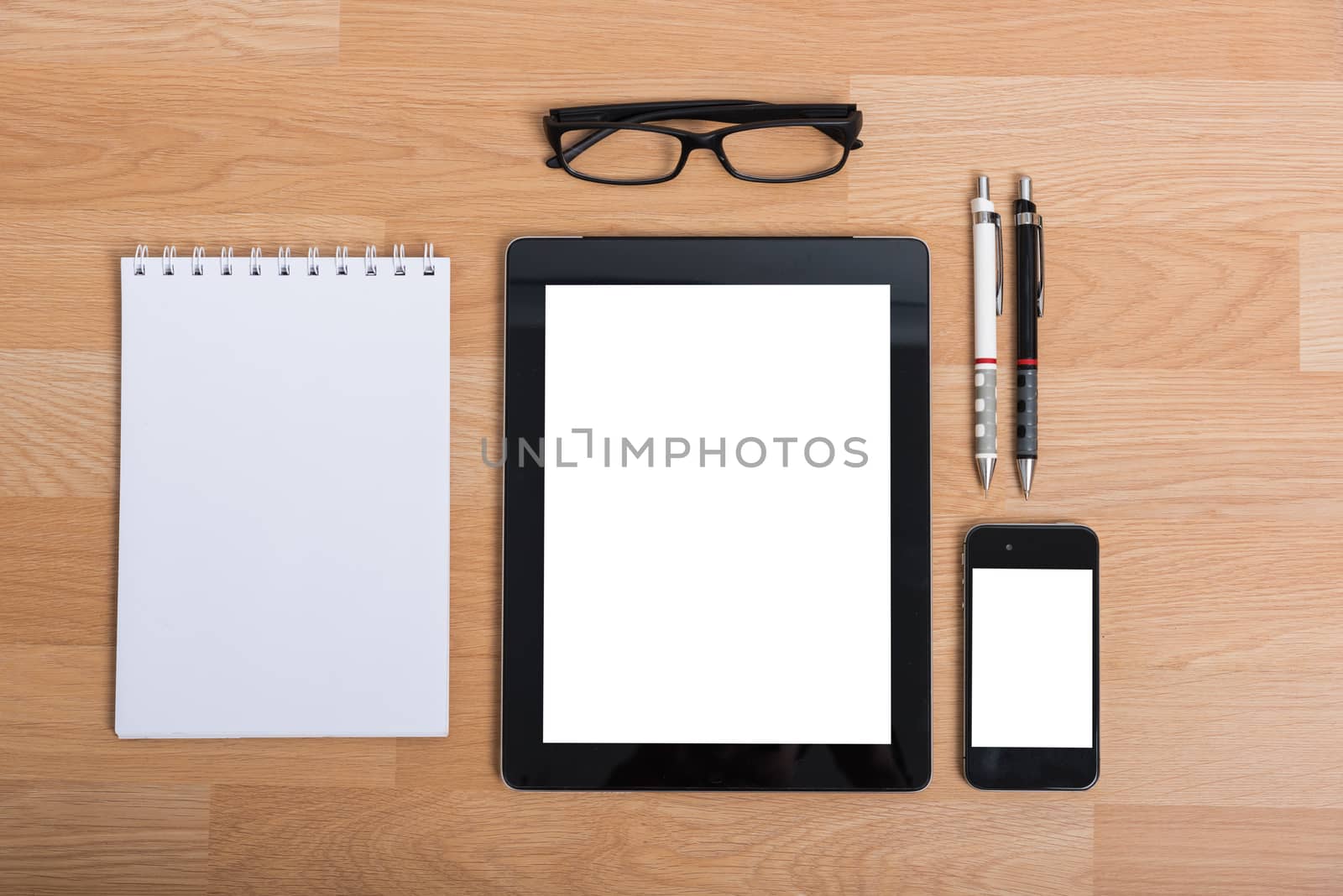 Top view office table with mobile phone, keyboard and mouse on wooden desk