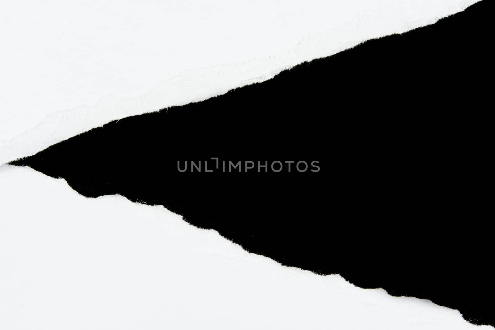 tear white paper pieces of paper on black background