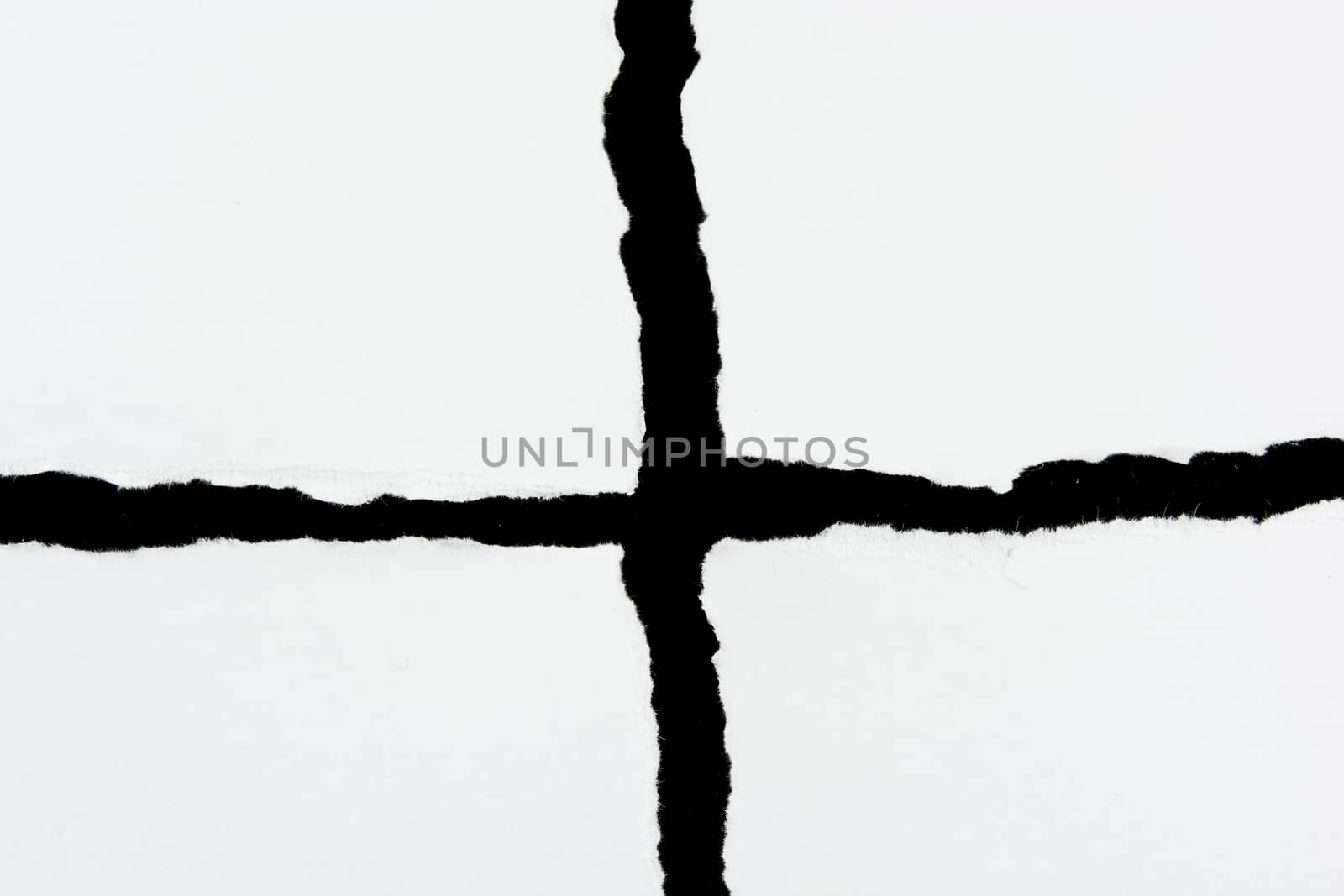 tear white paper pieces of paper on black background