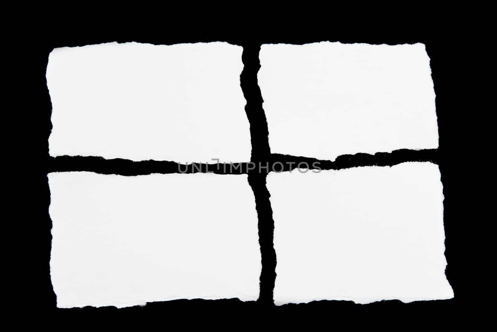 tear white paper pieces of paper on black background