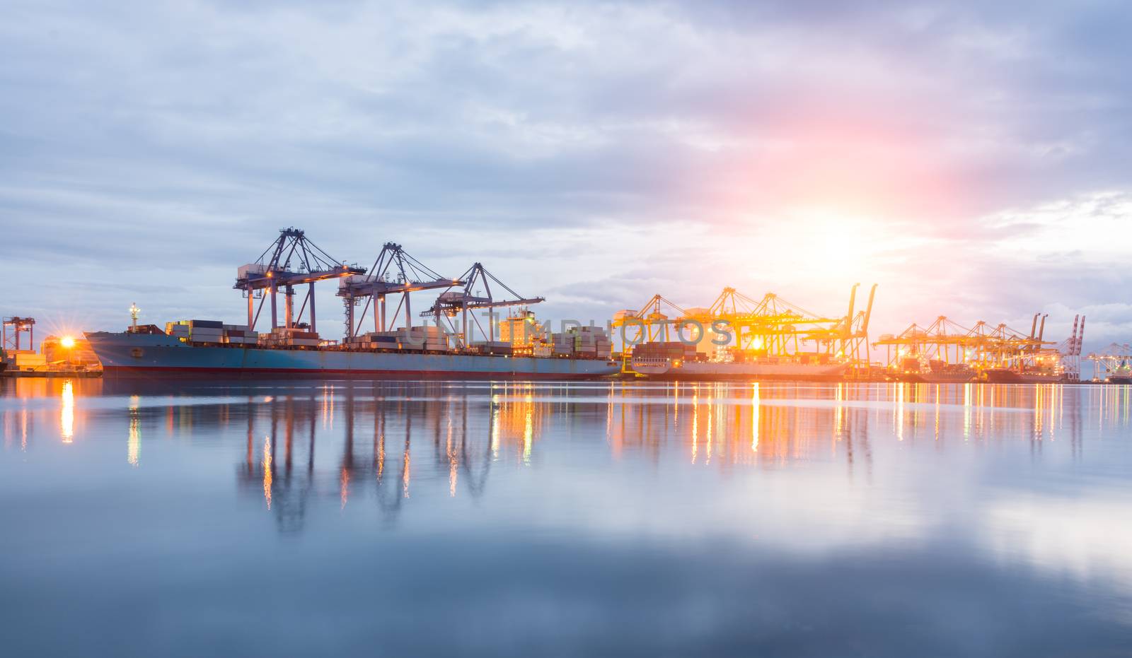 Containers loading Shipping by crane at morning or Trade Port