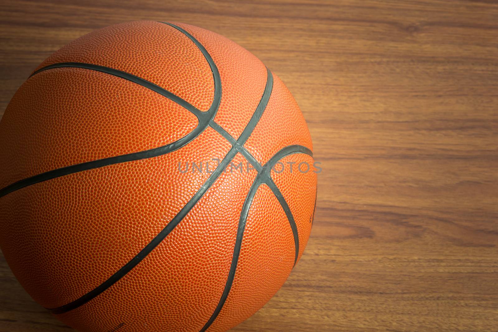 Close up Basketball on wooden floor background