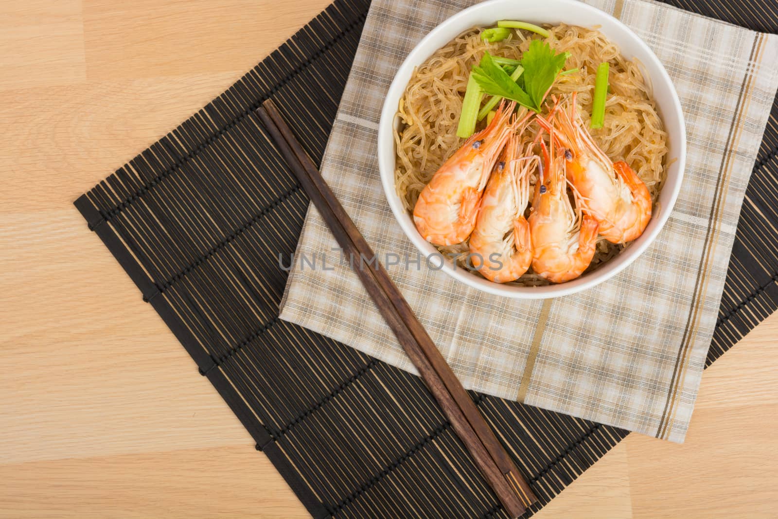baked vermicelli with shrimp in white cup on wooden background