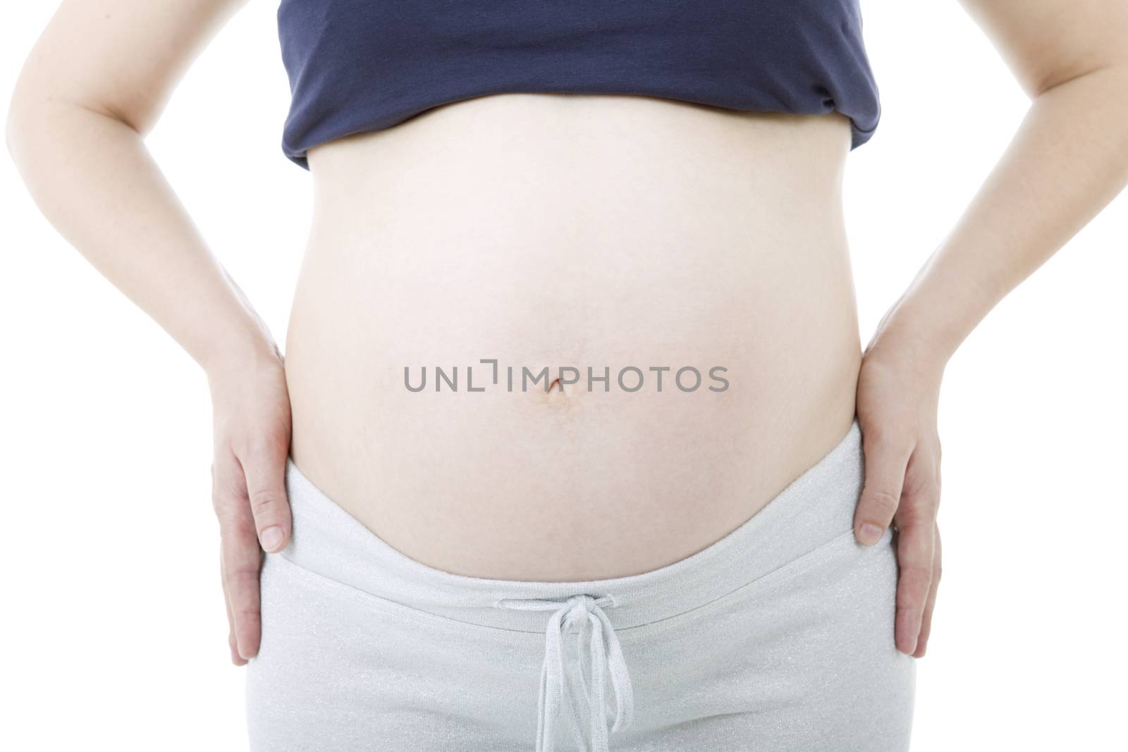 Closeup of pregnant woman at white background