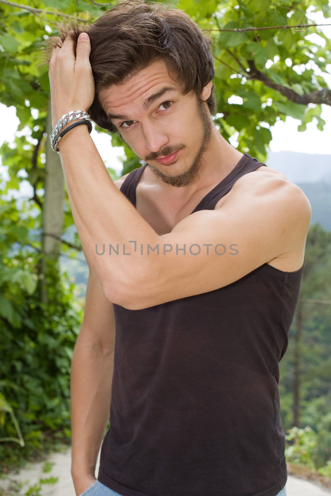 portrait of happy handsome young man, summer outdoors.