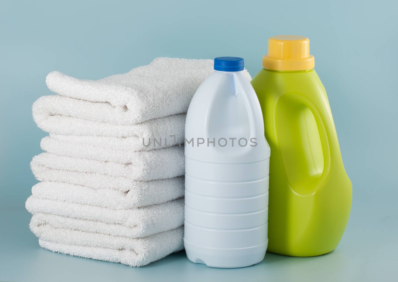 Laundry green detergent bottle and white bleach bottle