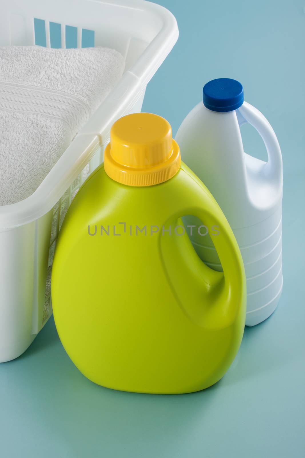 Laundry green detergent bottle and white bleach bottle