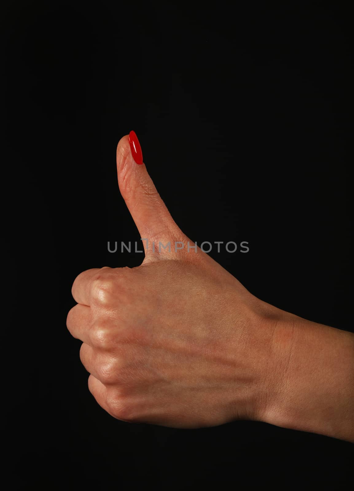 Woman hand with OK like gesture over black by BreakingTheWalls