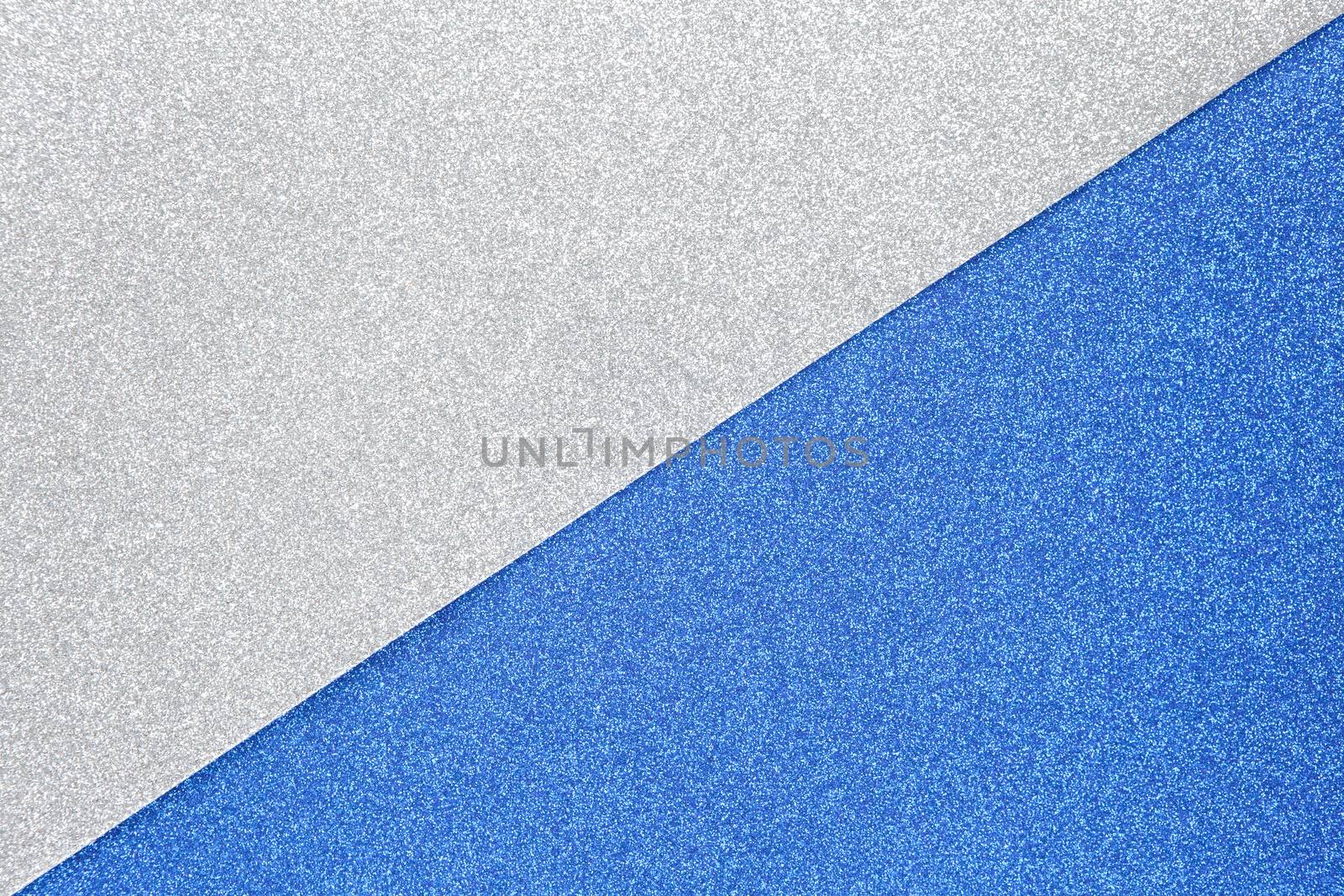 Silver and blue sparkling festive background. Colors are divided diagonally in frame. Copy space for text. Horizontal. Celebration, holidays, sales, fashion concept, harvesting for mock up. Top view.