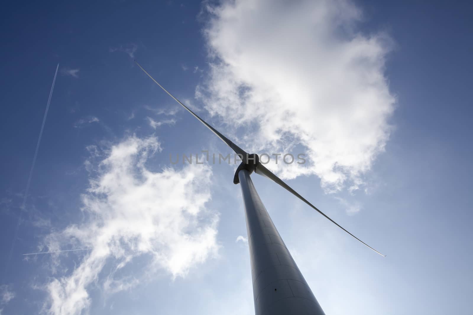 Windmill for electric power production. big windmill generating  by Tjeerdkruse