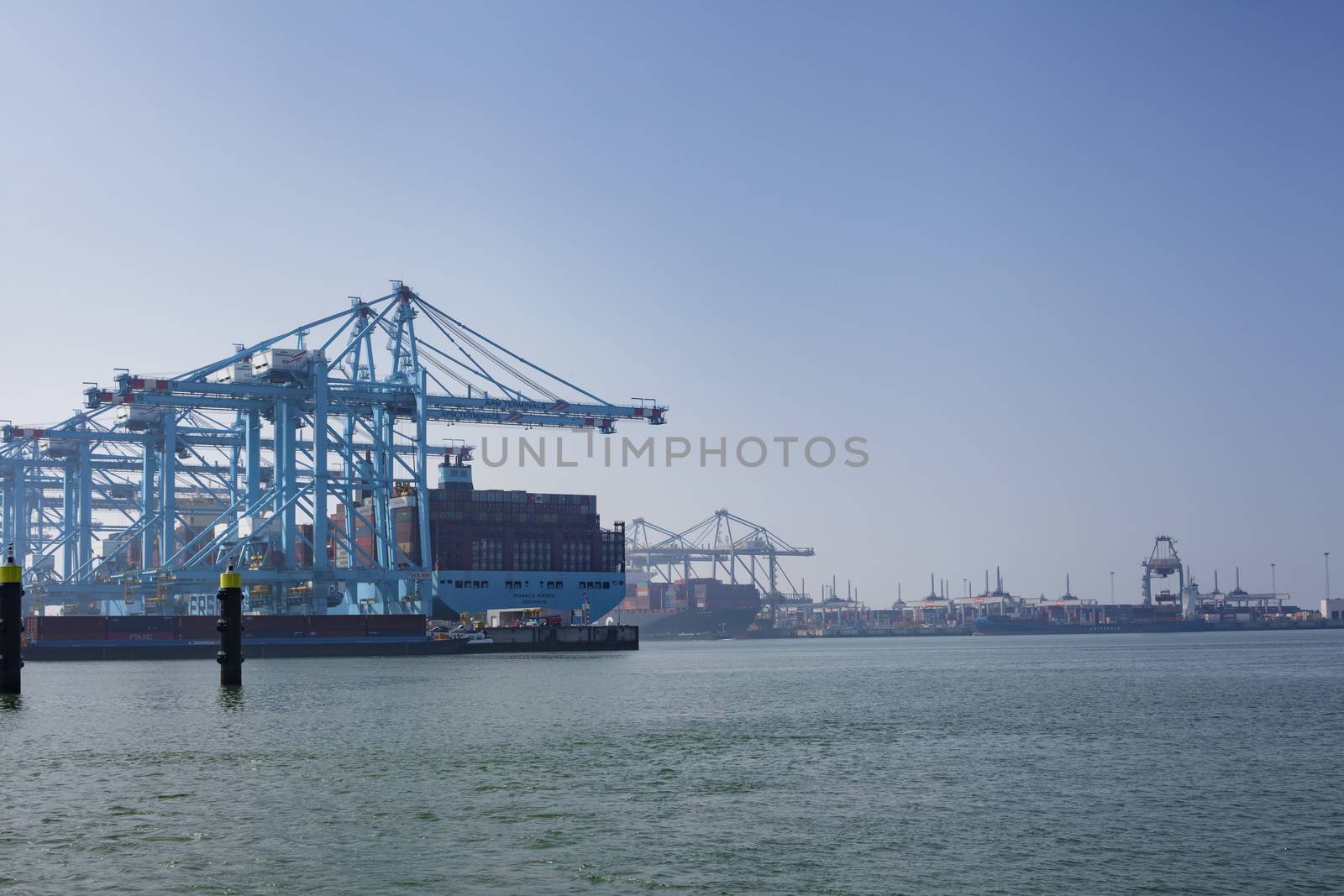 Rotterdam, Holland. Aerial view of container terminal in the harbor MAASVLAKTE, Netherlands. A large containership is unloading