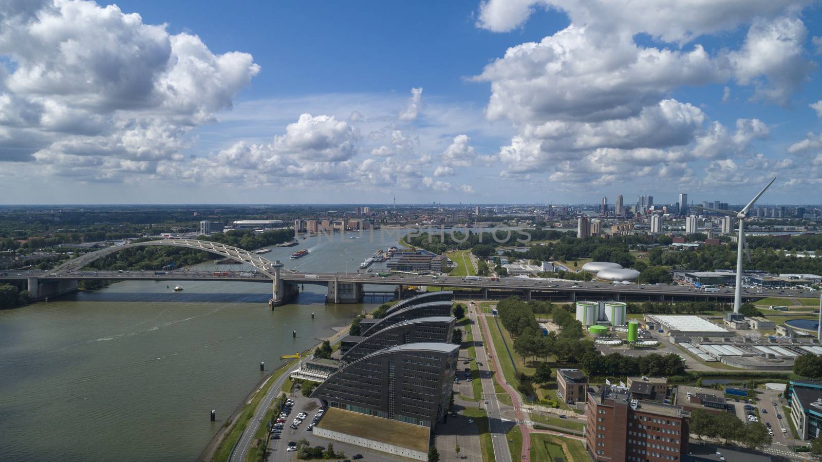 Van Brienenoord Bridge in Rotterdam over the river Nieuwe Maas seen from the north bank on the east side. The two arch bridges, part of the A16 motorway, were completed in 1965 and 1990 respectively.