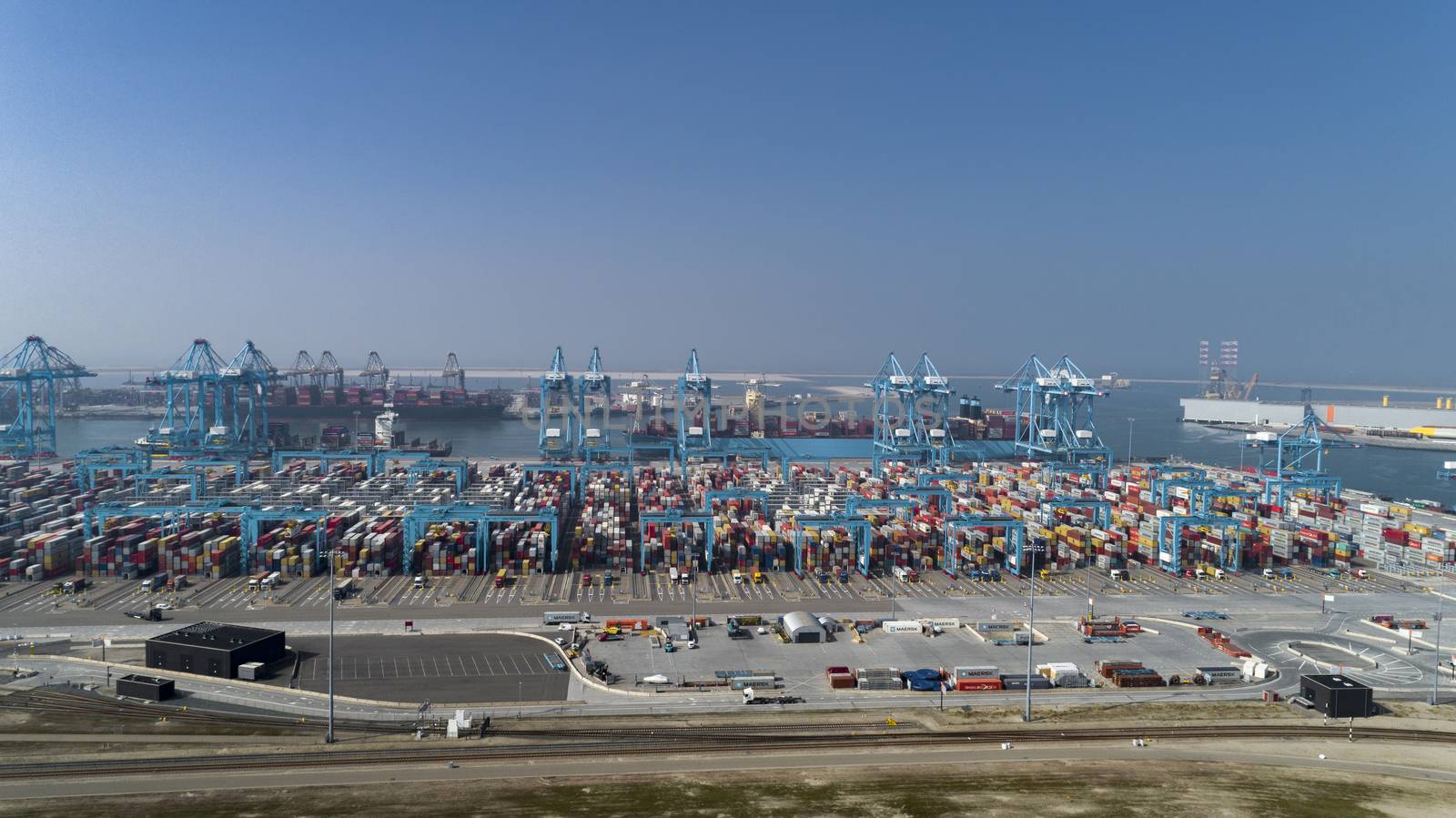 container terminal in the Rotterdam harbor by Tjeerdkruse