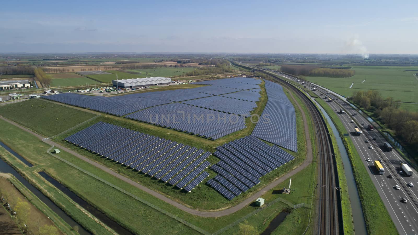 Modern Solar panel farm with photovoltaic panels for clean solar by Tjeerdkruse