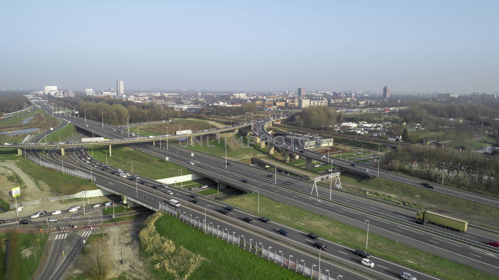 Aerial view of a massive highway intersection in Rotterdam, The  by Tjeerdkruse