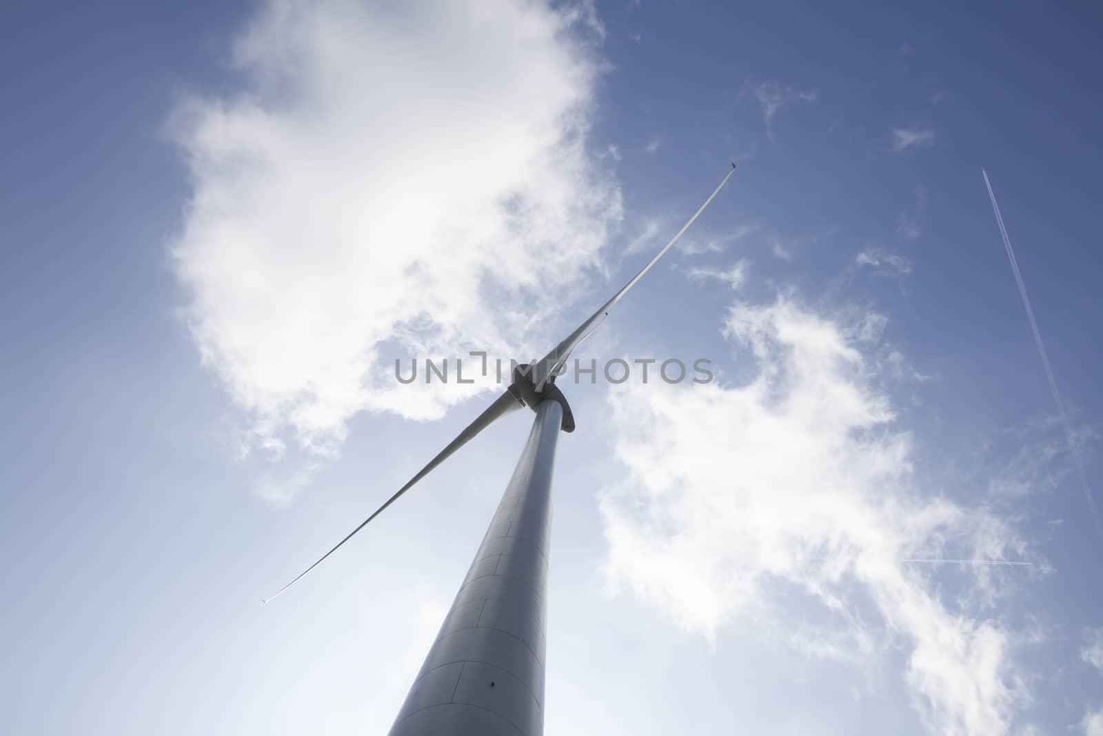Windmill for electric power production. big windmill generating  by Tjeerdkruse