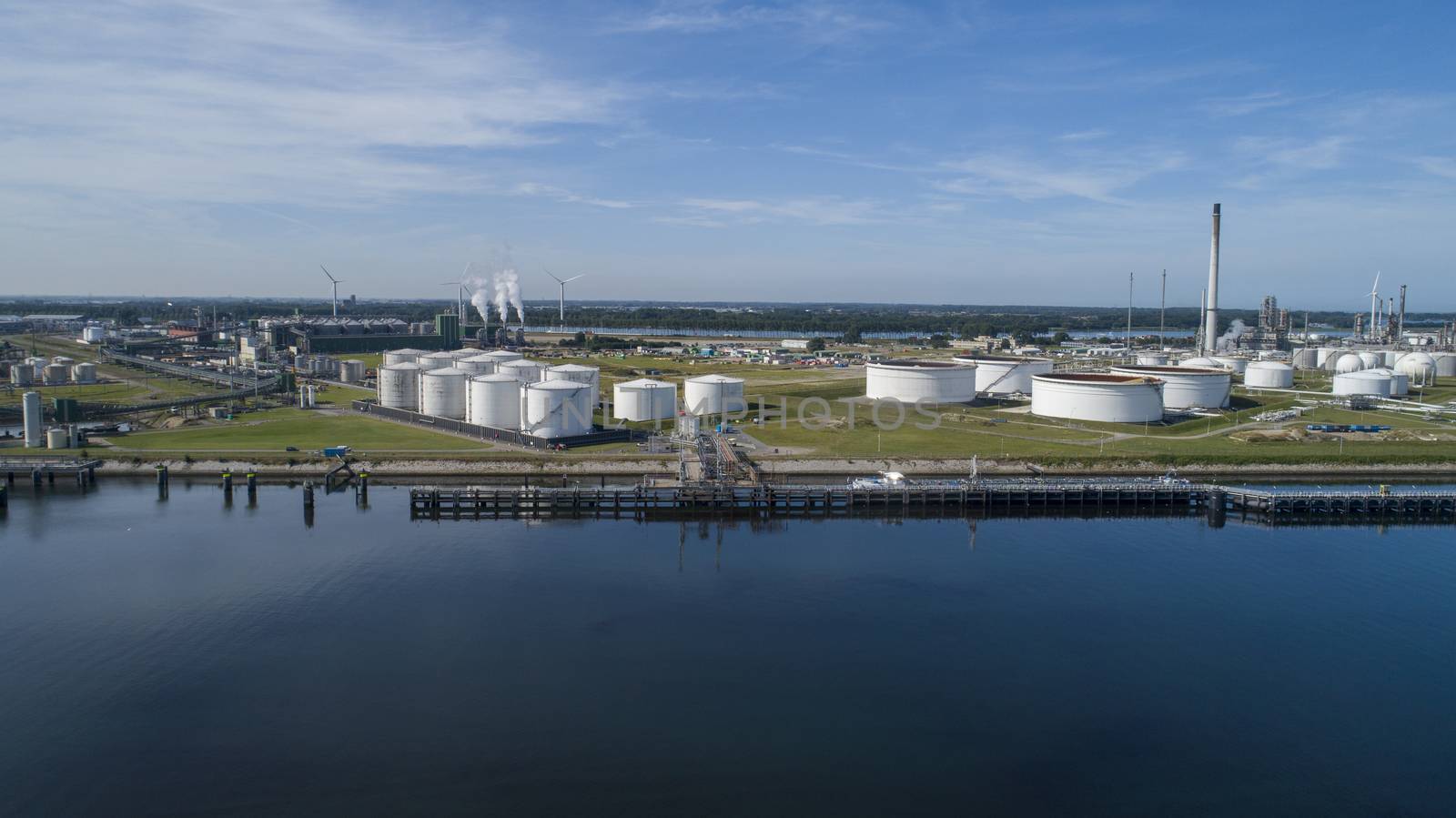 Oil refinery plant from industry zone, Aerial view oil and gas industrial, Refinery factory oil storage tank and pipeline steel