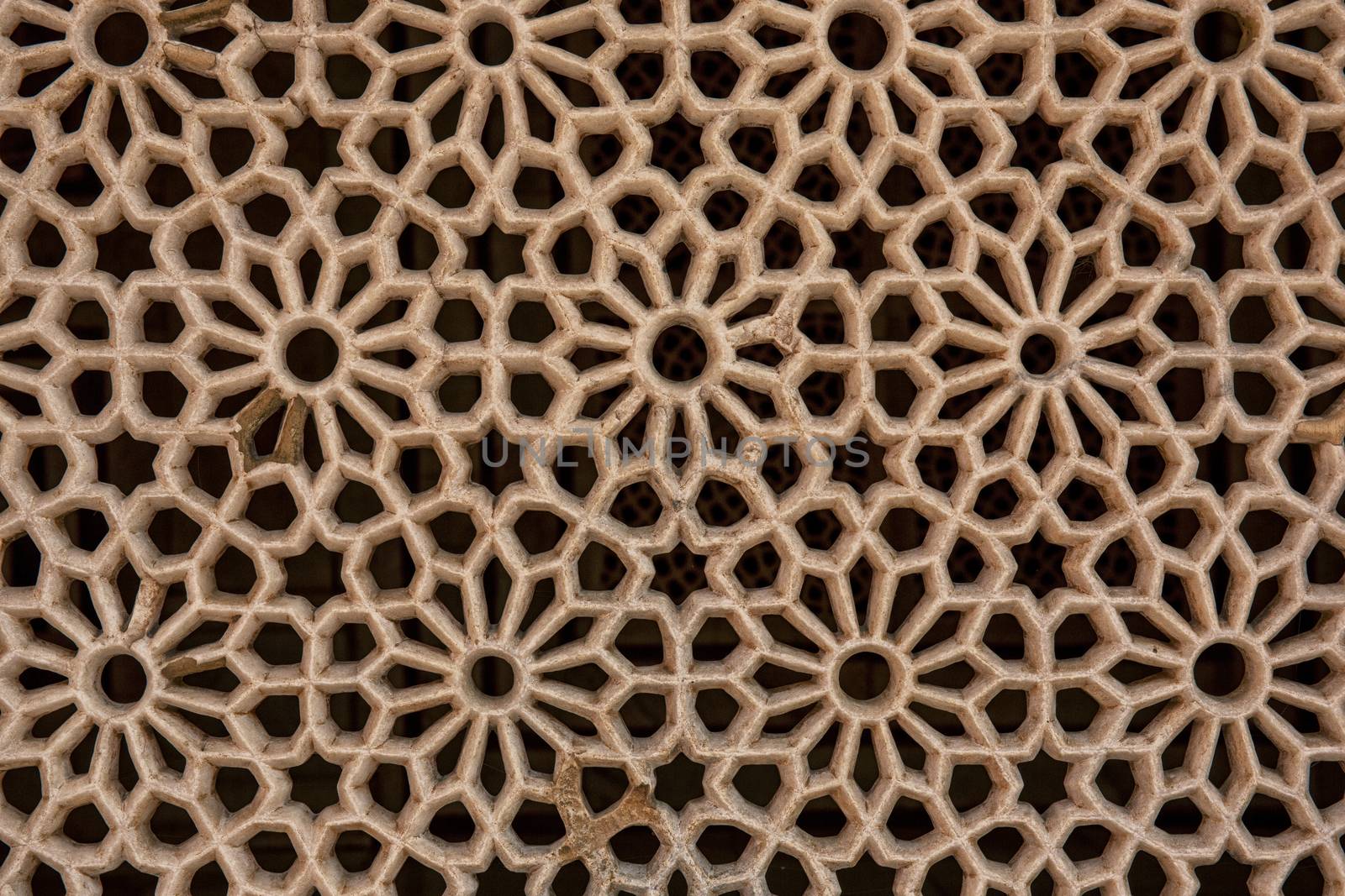 Texture of stone grating at Red Fort in Agra, India. Texture