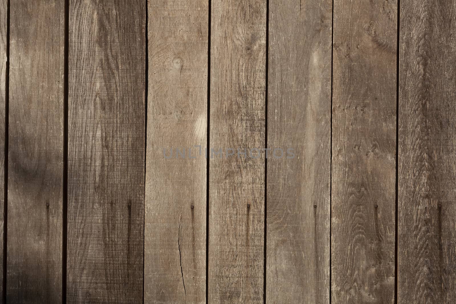 Brown wood planks background texture closeup by Tjeerdkruse