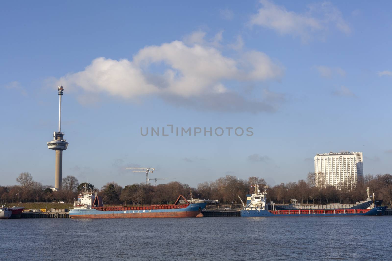 An ocean going freighter with the Euromast Tower in the backgrou by Tjeerdkruse