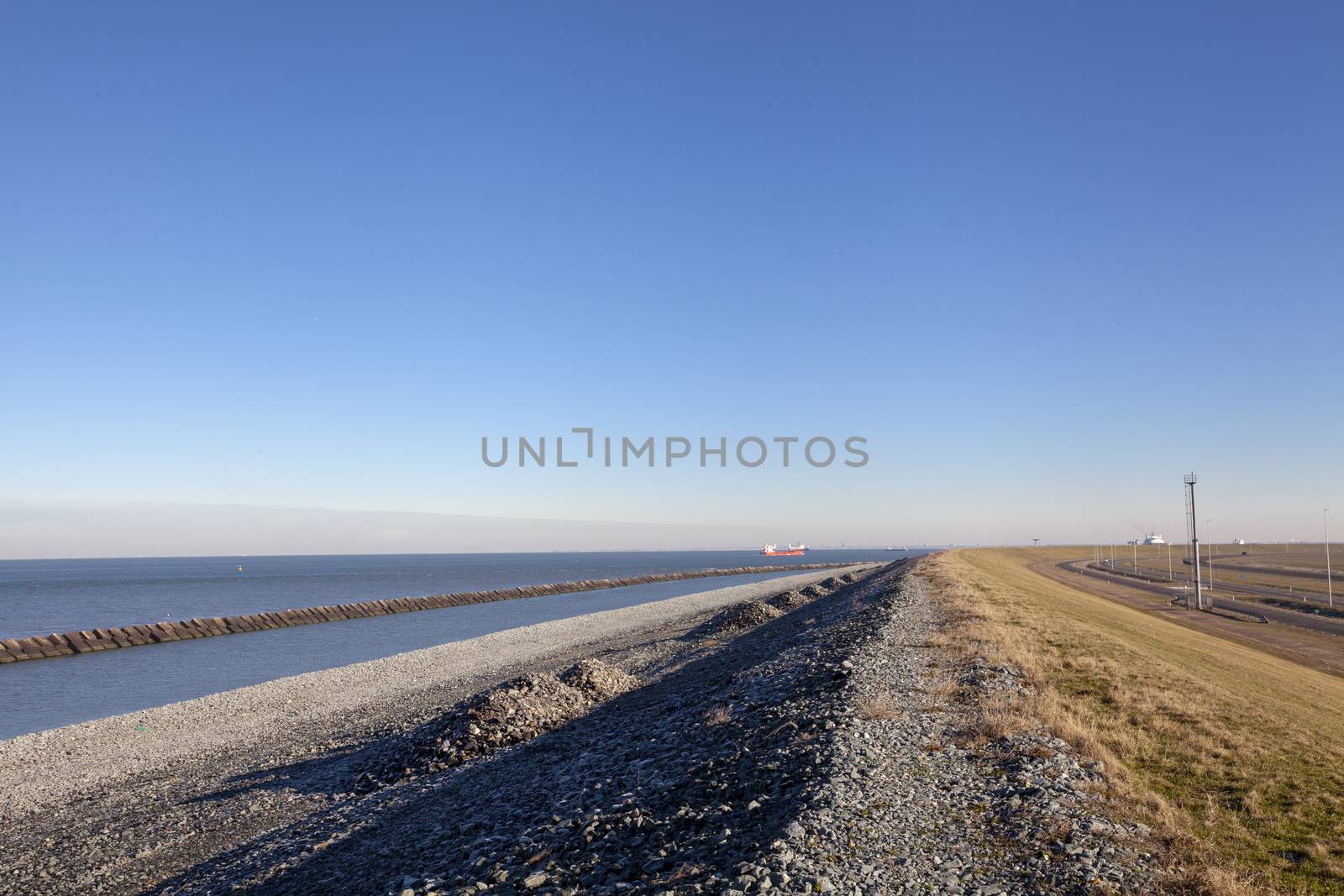 Concrete breakwaters. Seascape with tetrapodes to protect coasta by Tjeerdkruse
