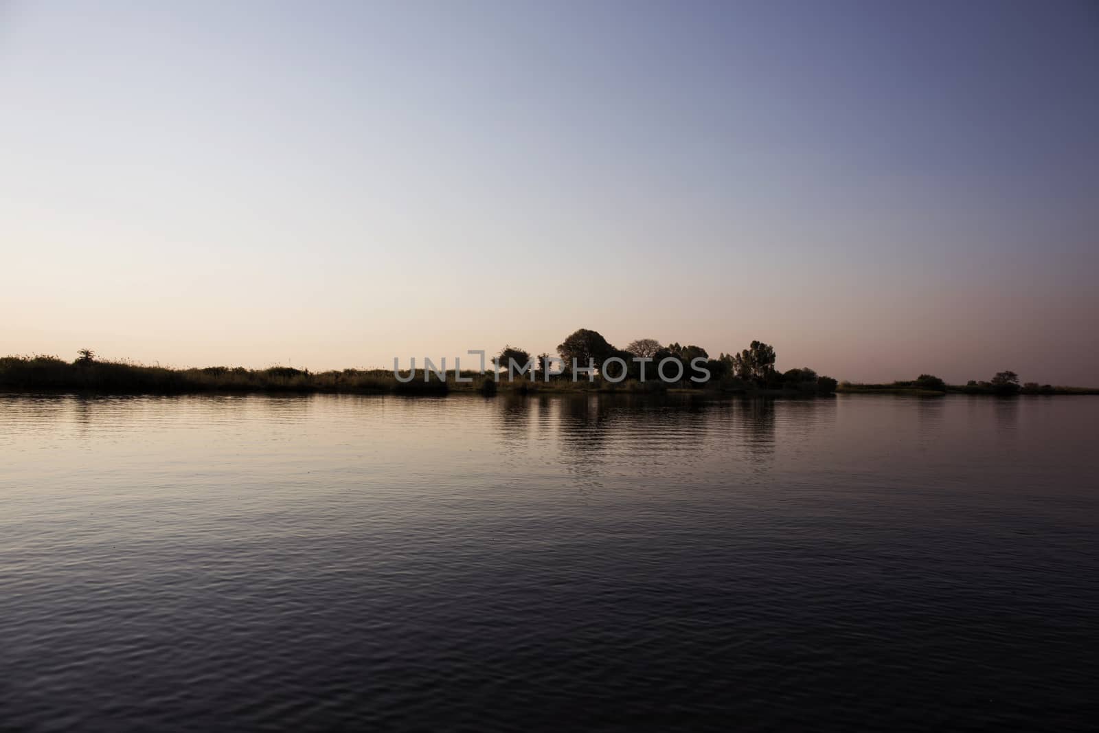 Okavango Delta Sunset by Tjeerdkruse