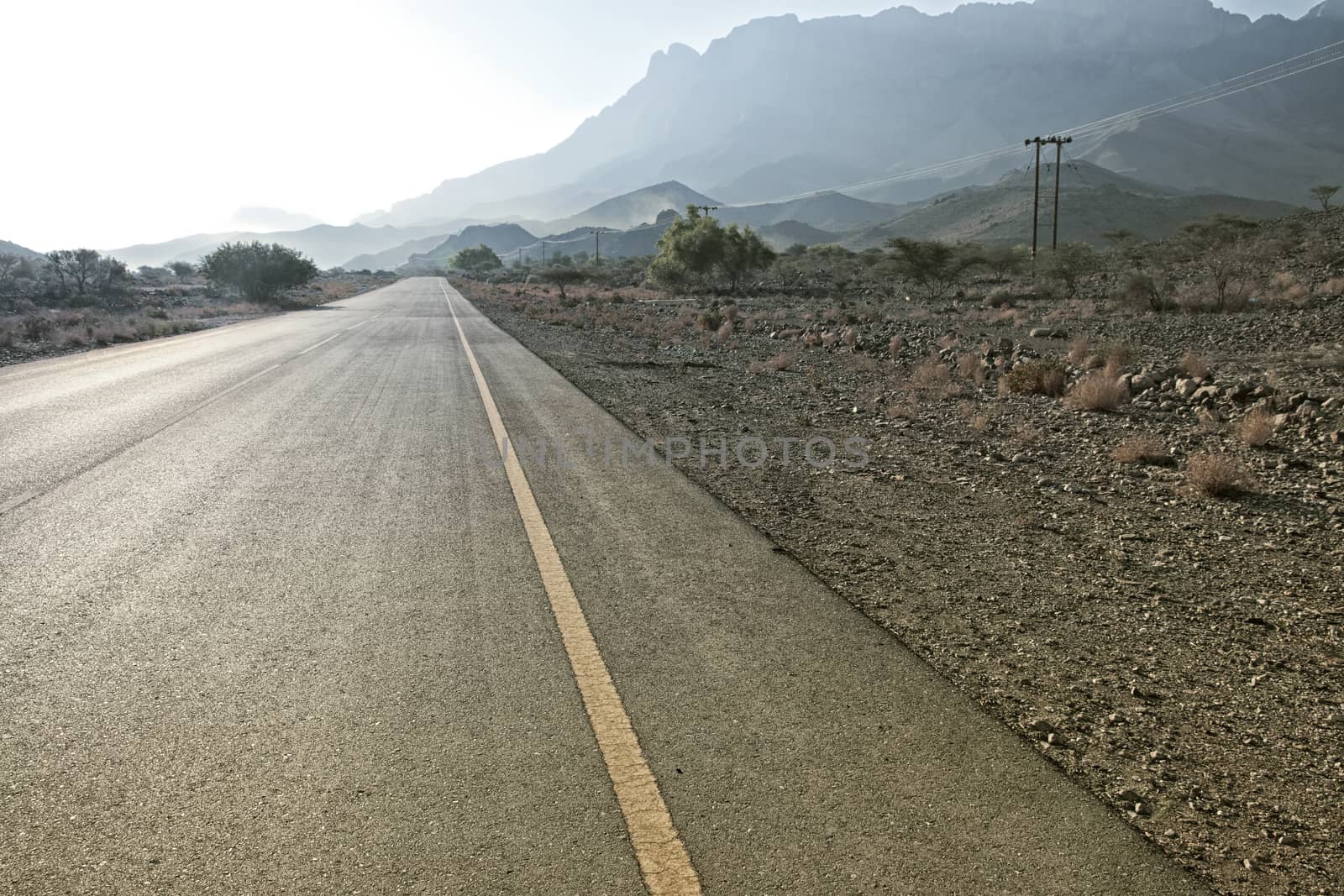 view of a road leading to the Jebel Shams in Hajar mountains in  by Tjeerdkruse