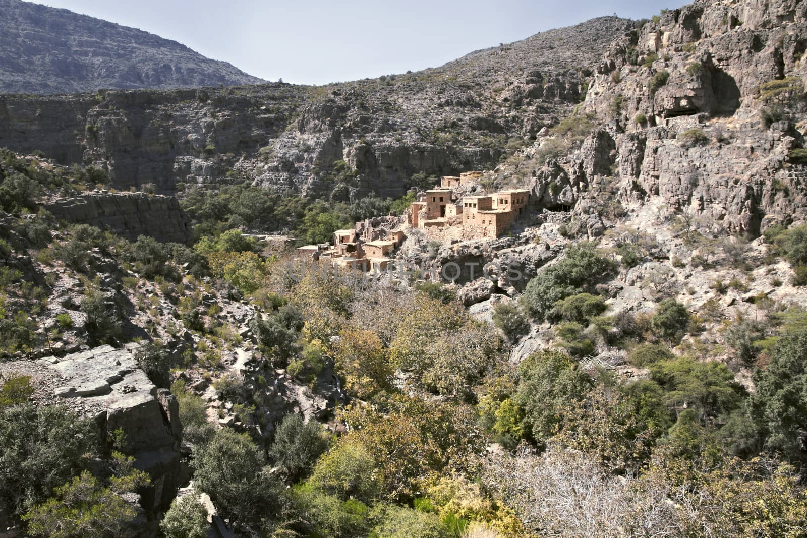 View of ruins of an abandoned village at the Wadi Bani Habib at  by Tjeerdkruse