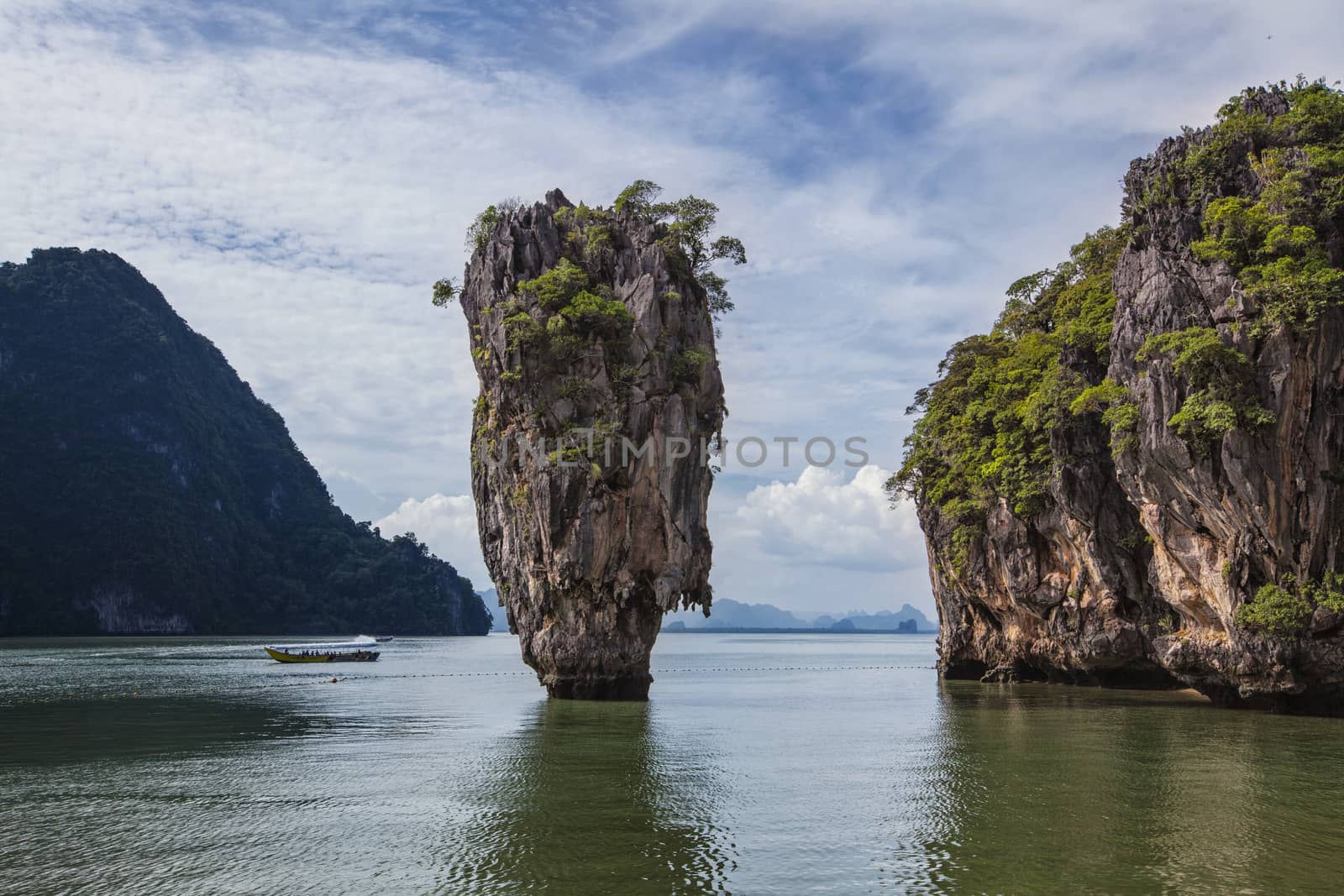 James bond island in Phang Nga bay with couldy sky and clear wat by Tjeerdkruse