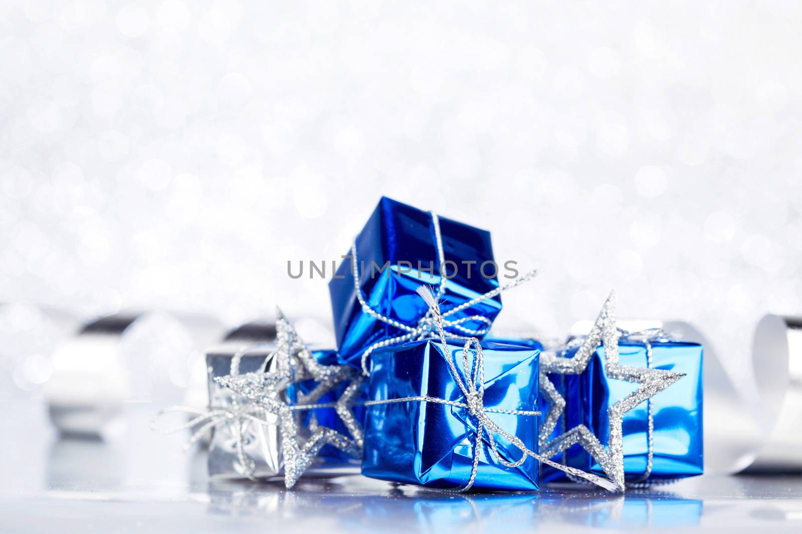 Christmas decoration on shiny silver glitter background