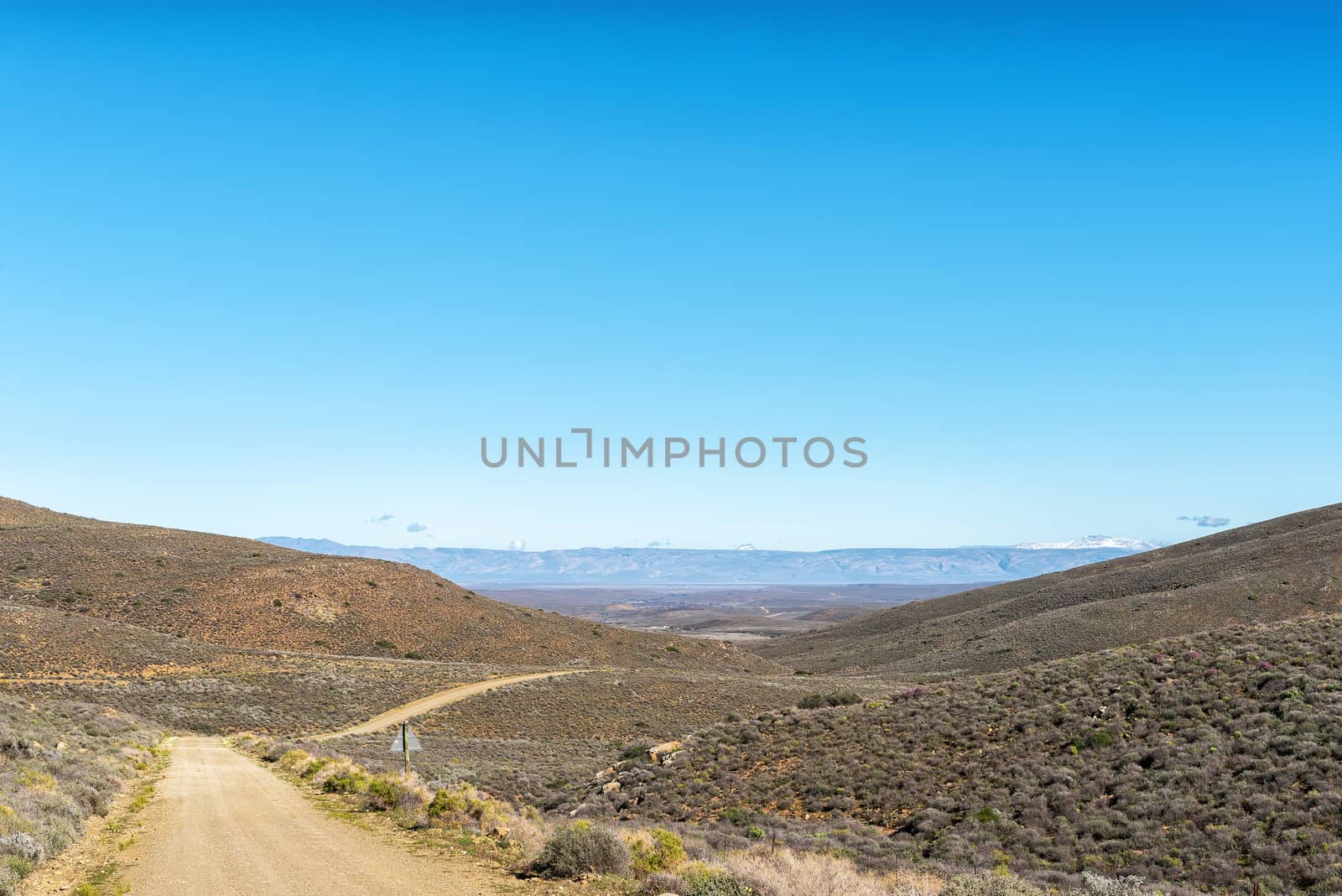 A landscape on road R356 to Ceres in the Western Cape Province. Snow is visible on Sneeuberg in the Cederberg, to the right