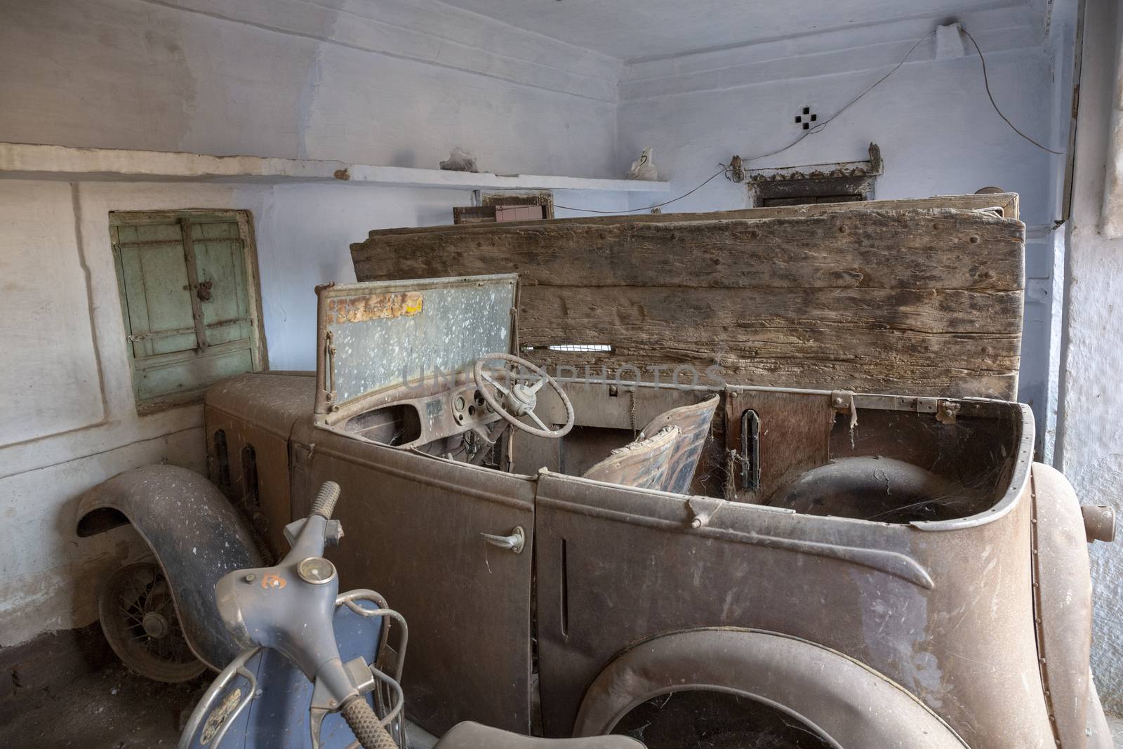 Junk Yard with an old rundown Vintage Car by Tjeerdkruse