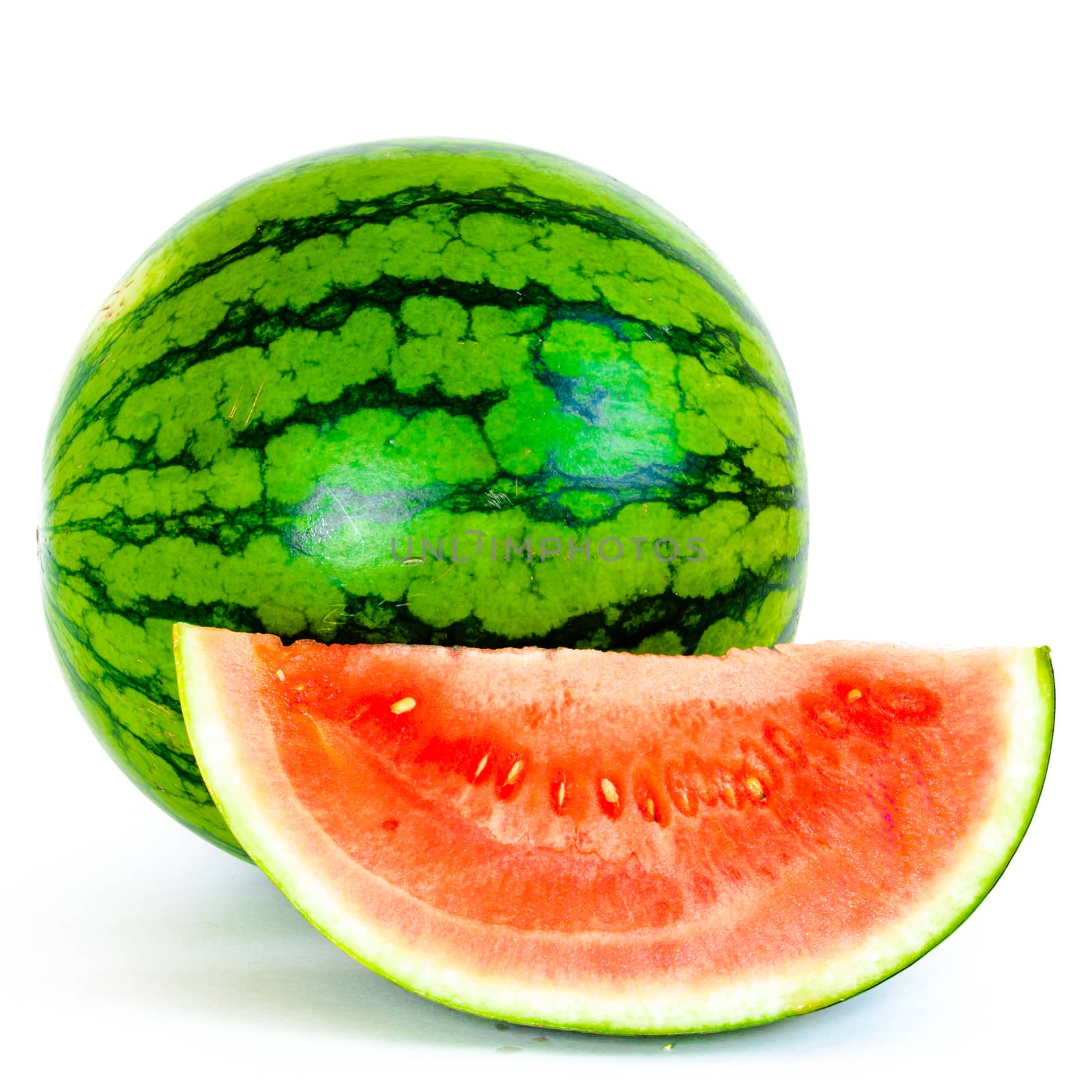 Studio shot mini organic watermelon with one slice cut isolate on white by trongnguyen