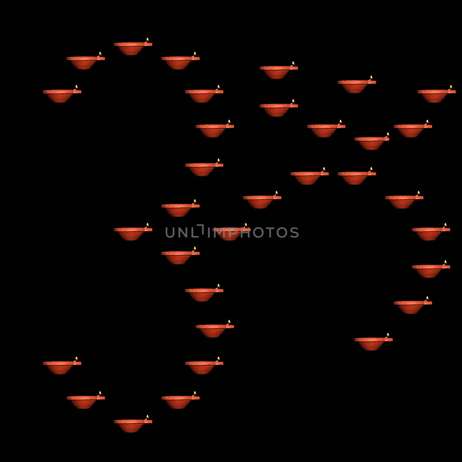 The holy Hindu auspicious symbol of OM made of traditional earthen Diwali Lamps on black background.