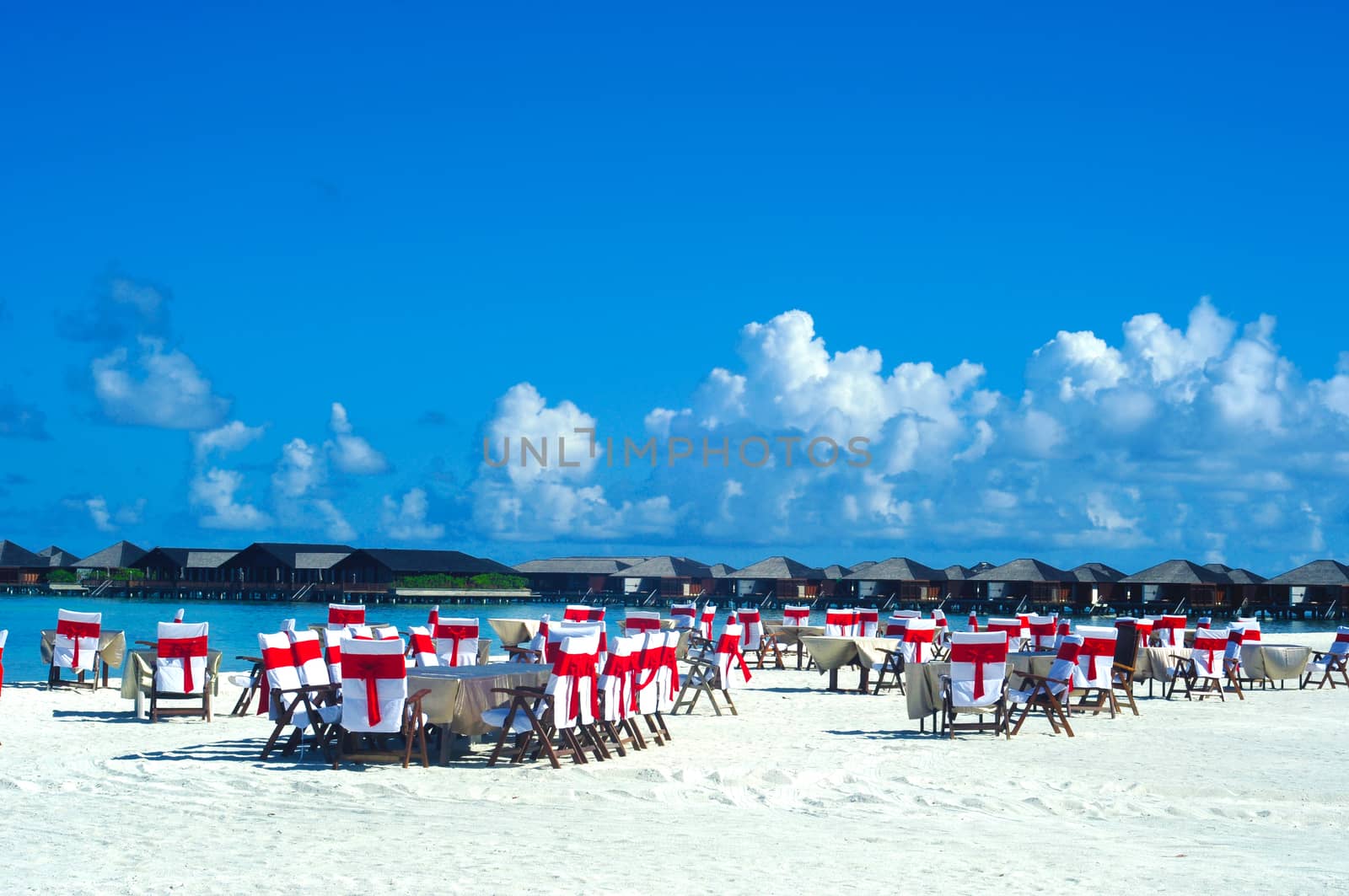 Romantic luxury dinner or lunch setting at tropical beach in Maldives