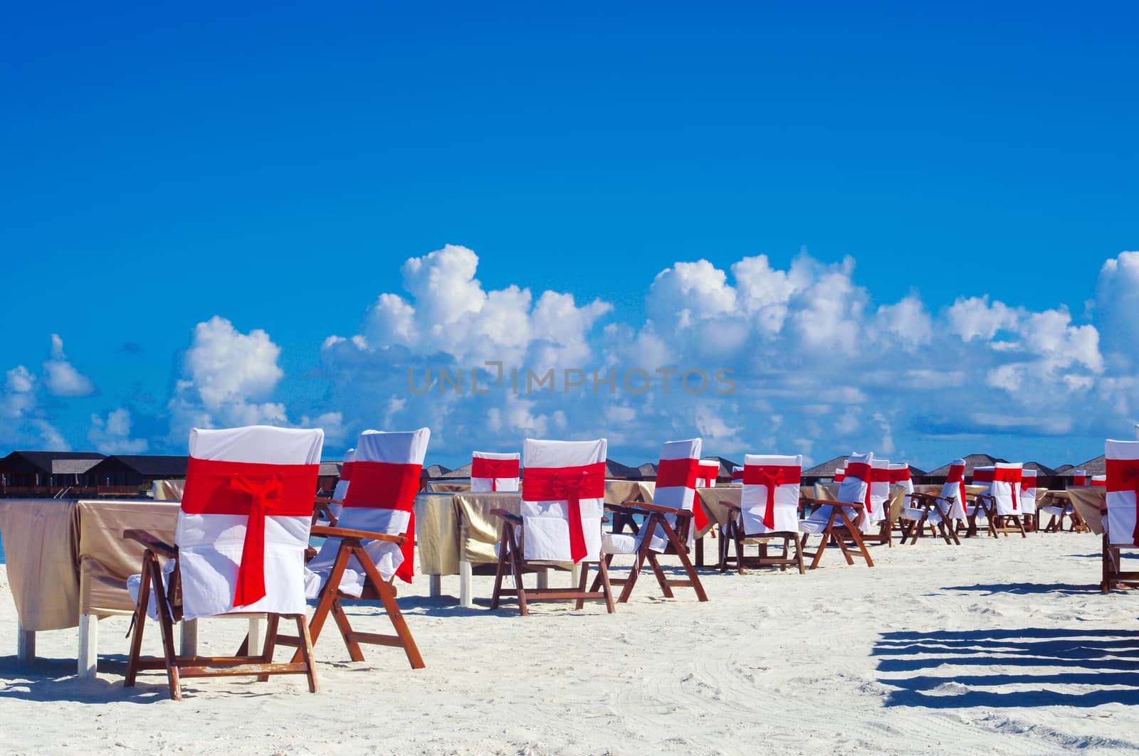 Romantic luxury dinner or lunch setting at tropical beach in Maldives